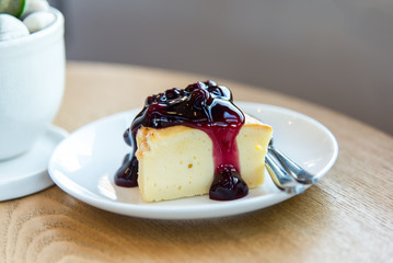 blueberry cheese pie on white plate.