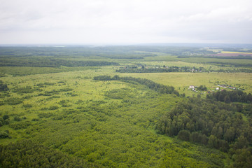 Fototapeta premium Aerial photography. Aerial view over the rural landscape in Russia