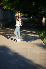 Walking woman sidewalk outdoor, casual style clothes