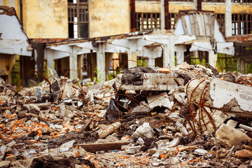 A closeup image of a garbage dump with ruined brick and wooden planks. Concept of disaster, war.