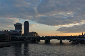 Fototapeta na wymiar Amazing sunset Cityscape from Millennium Bridge and Thames River, London, Great Britain