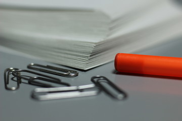 stationery background with paper and paper clips