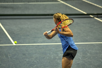 Fototapeta na wymiar Tennis player, fast movement, defocus.