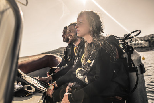 Group Of Scuba Divers On A Boat