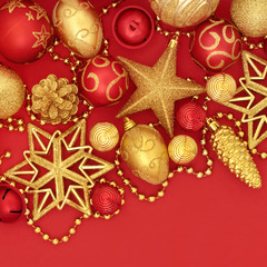 Fototapeta na wymiar Christmas red and gold bauble decorations forming a background.