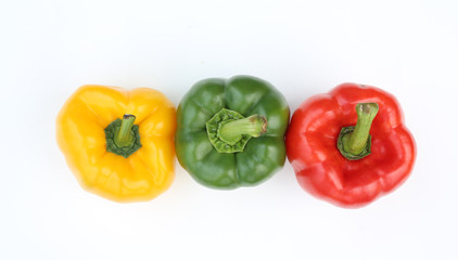 Green , red and yellow bell pepper isolated on white background.