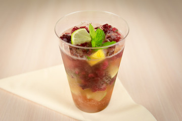 Raspberry lemonade with mint on wooden table