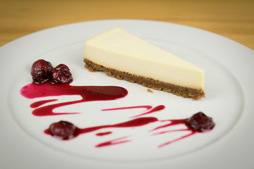 Cheesecake from white chocolate on white plate