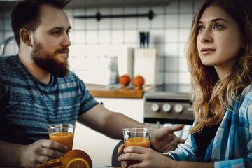 Couple drinking orange juice