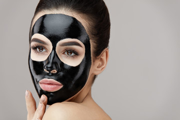 Female Beauty Face Skin Masking. Girl With Black Peeling Mask