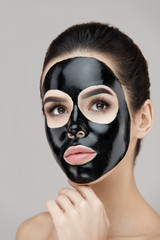 Beauty Face Care Peeling. Closeup Female With Black Peeling Mask On Skin