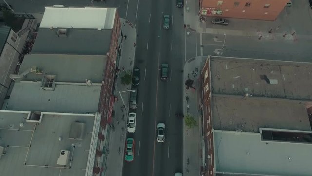 Aerial tracking shot of traffic on a city road