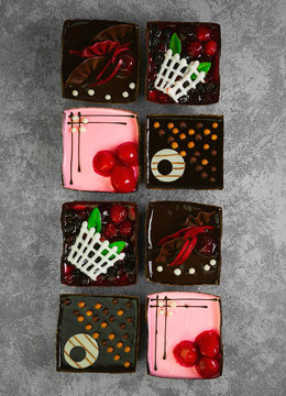 Different pastries tasty assortment. Dessert tray assorted top view background. Cakes, bright, colorful pastry sweets with fresh berries. French Bakery pattern. Flat lay. Blank space.