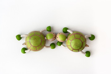 Toy turtles kissing. Romantic background