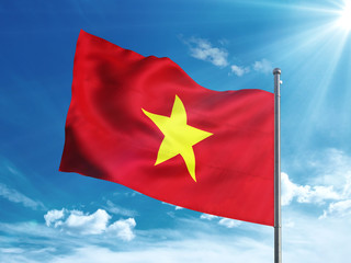 Vietnam flag waving in the blue sky