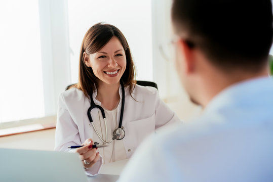 Female Doctor Giving A Consultation To A Patient And Explaining Medical Informations And Diagnosis.