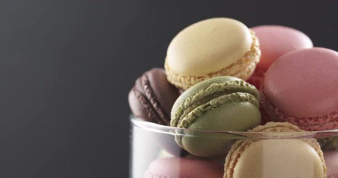 mixed macarons in glass bowl rotating loopable video