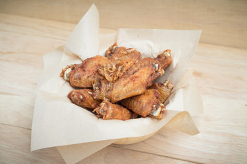 Fried chicken wings and crispy garlic in plate