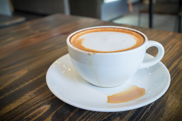 hot coffee mocha with foam milk in vintage cafe
