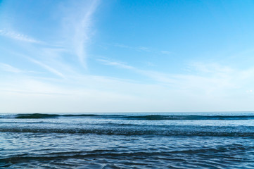 Blue sky beach and small wave.