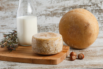 Artisan cheese on wooden table
