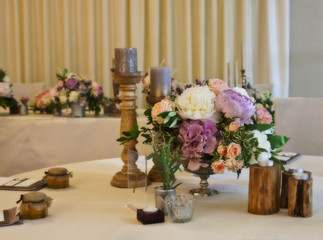table decorations with candles and natural flowers