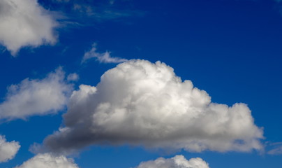 Naklejka na ściany i meble Clouds against the blue sky background