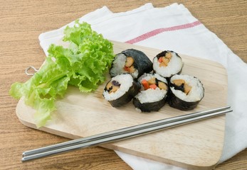 Veggie Sushi Rolls or Vegetable Maki on Wooden Board