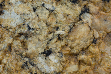 Heterogeneous texture of natural stone orange.
