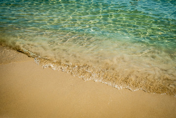 Turquoise waters exceptionally strong colors with yellow fine sand, the coast and the beautiful sunny day