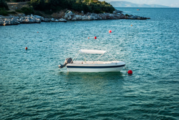 Fototapeta na wymiar The blue sea with yachts and boats on the water, Skiathos, Greece