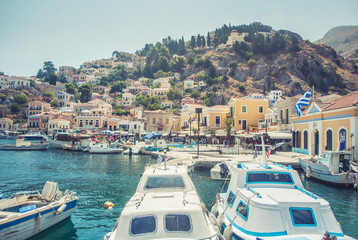 Symi, Greece - September 03, 2015: Wonderful Greece. Island Symi, with a turquoise sea, the yachts in the harbor and colorful houses on the slopes of the island