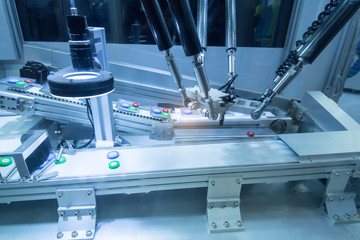 Automatic robot in assembly line working in factory. Smart factory industry 4.0 concept.