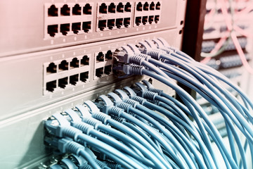 Network cables in switch and firewall in cloud computing data center server rack