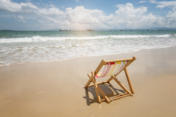 Fototapeta na wymiar Deck chair at the tropical beach