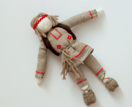 Belarusian rag doll made of linen with a national pattern on a white background
