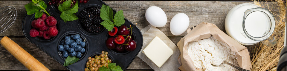Baking concept - ingredients on rustic wood background