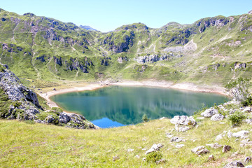 Fototapeta na wymiar mountains and Saliencia's lake full of water in Asturias, Spain