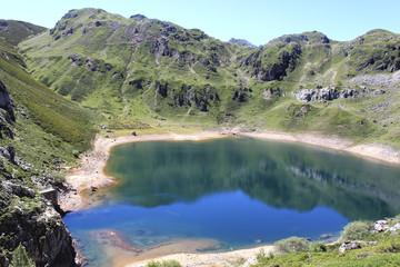 mountains reflected in Saliencia's lake in Asturias, Spain