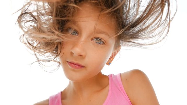 Blue-eyed girl.&nbsp;Beautiful girl with blue eyes looks at the camera. Happy child. Close-up.