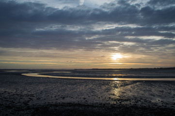 Obraz premium Sunrise over a river estuary
