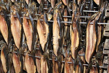 A Close Up of Kippers Hanging in a Smoking Cabinet.