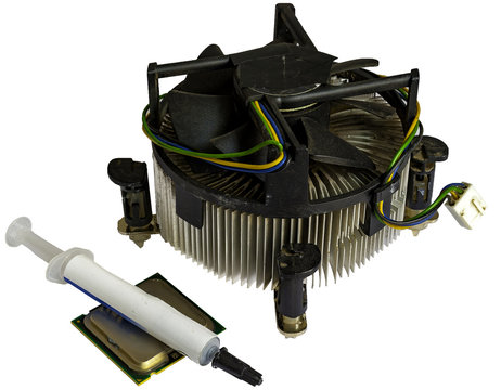 Close up of a heat sink, processor and a thermal pasta syringe on a white background