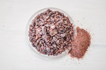 healthy himalayan pink salt rocks and powder in glass plate