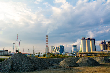 Fototapeta na wymiar Panorama of a thermal power station. Cooling tower, turbine, generator.