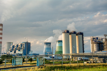 Fototapeta na wymiar Panorama of a thermal power station. Cooling tower, turbine, generator.