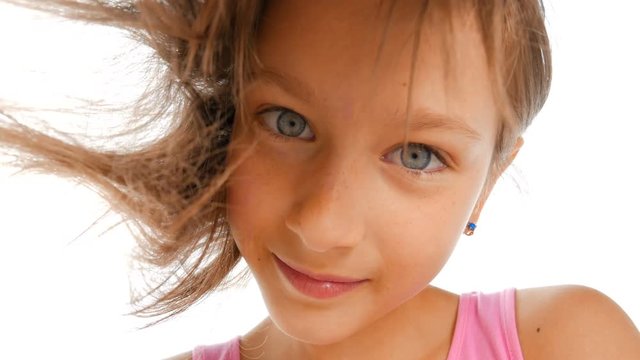 Blue-eyed girl.&nbsp;Beautiful girl with blue eyes looks at the camera. Happy child. Close-up.