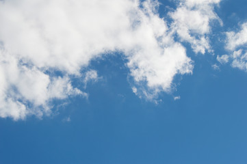 White clouds against the blue sky.