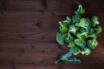 Fresh broccoli. Many green broccoli on a wooden table. Top view