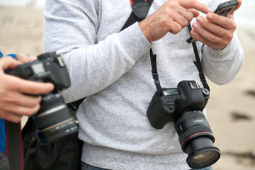 A man with electronics for photography